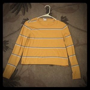 A striped yellow blue and white long sleeve
